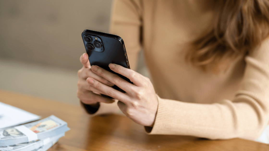 Cropped image of a woman using a mobile phone