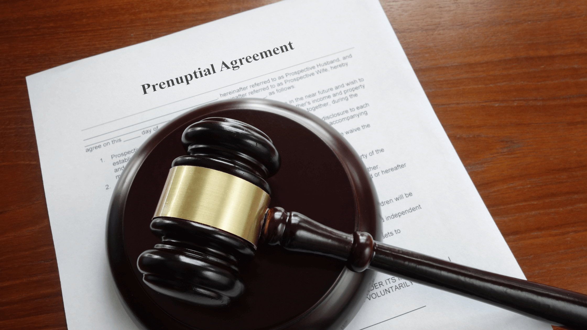 A judge's gavel rests on a signed document titled "Prenuptial Agreement," symbolizing the legal protection and formality of a prenup or postnup in managing community property and separate property in Texas.