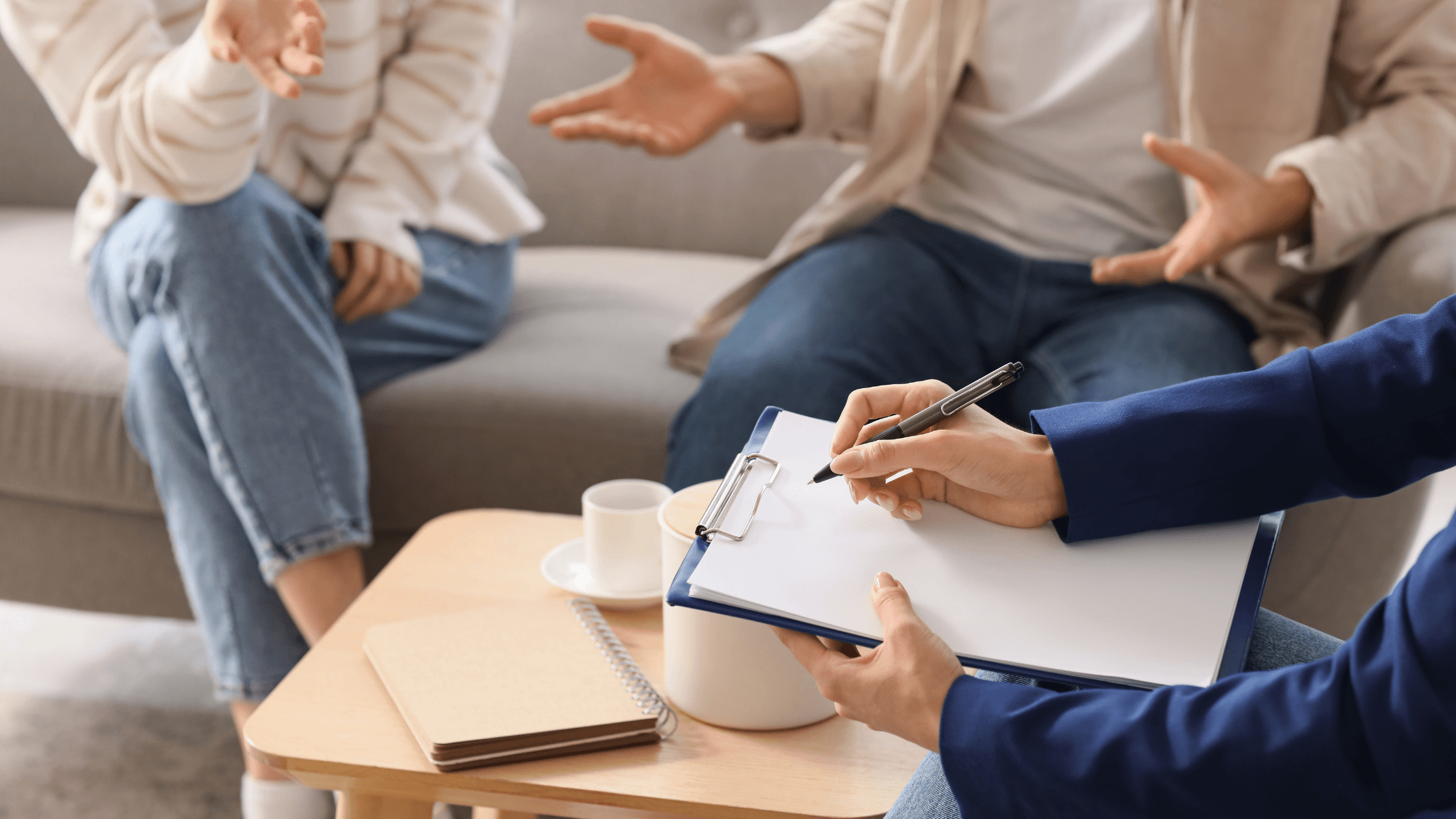 Divorcing couple talking with mediator during a Texas divorce mediation session